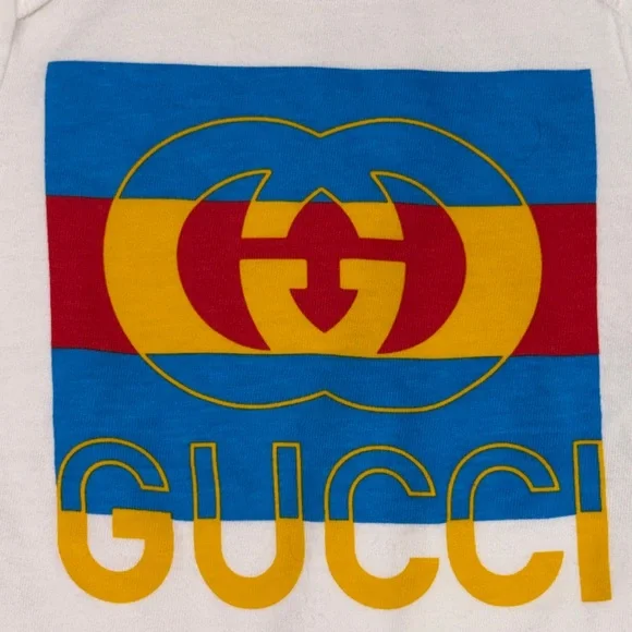Gucci Kids' White Bib, Onesie And Beanie Set with Blue, Red, and Yellow Accents - Picture 5 of 7